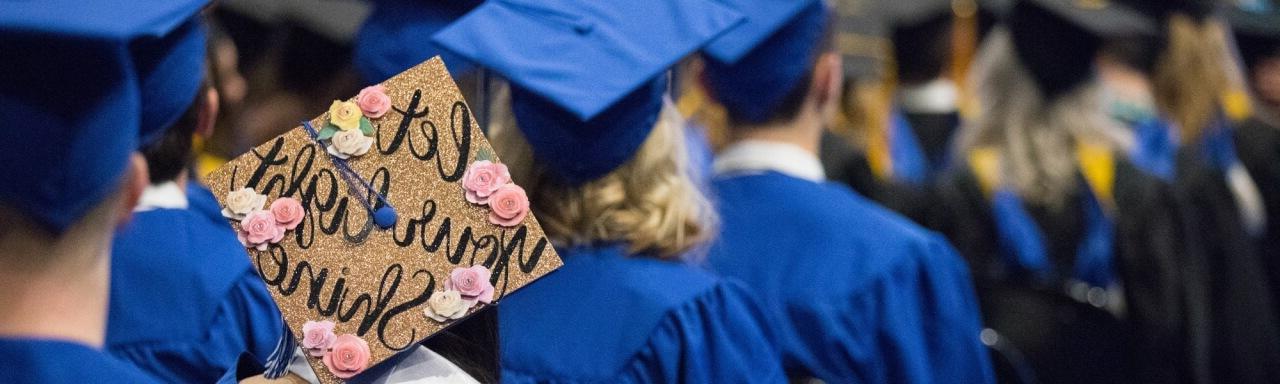 students in graduation gowns and caps